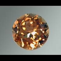 A picture of a reddish-brown andalusite gemstone